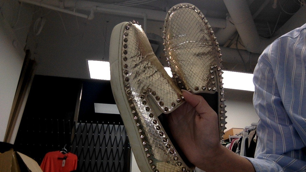Louboutin gold embossed spike sneaker