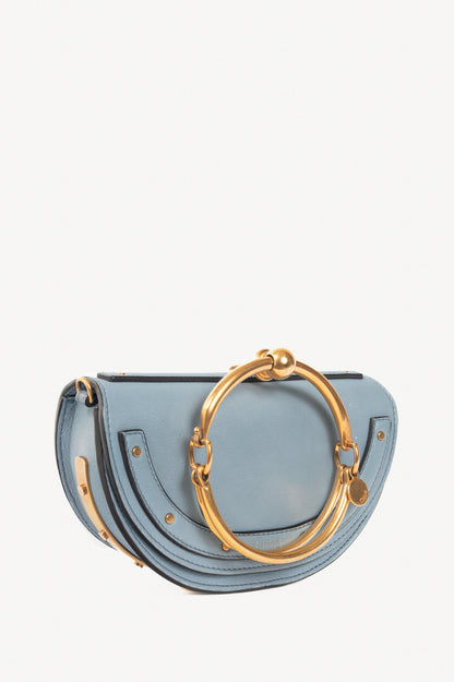 Chloe blue circle handle nile clutch
