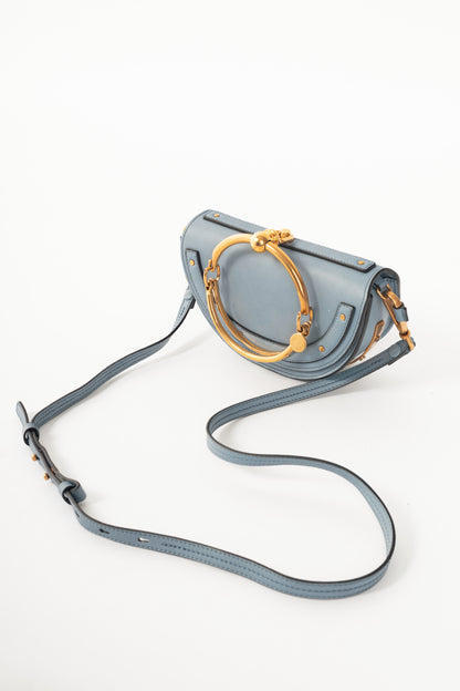 Chloe blue circle handle nile clutch