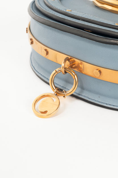 Chloe blue circle handle nile clutch