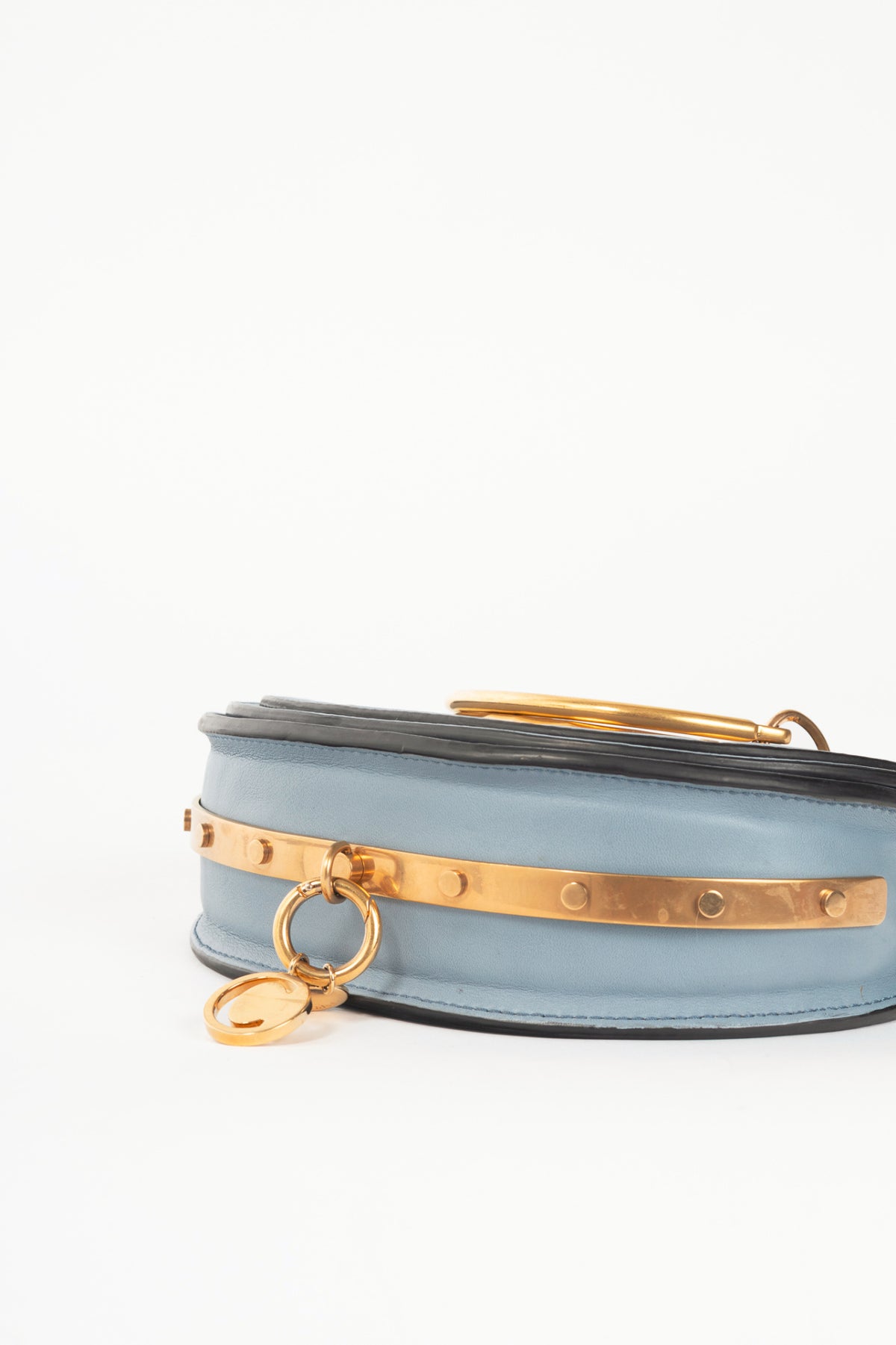 Chloe blue circle handle nile clutch