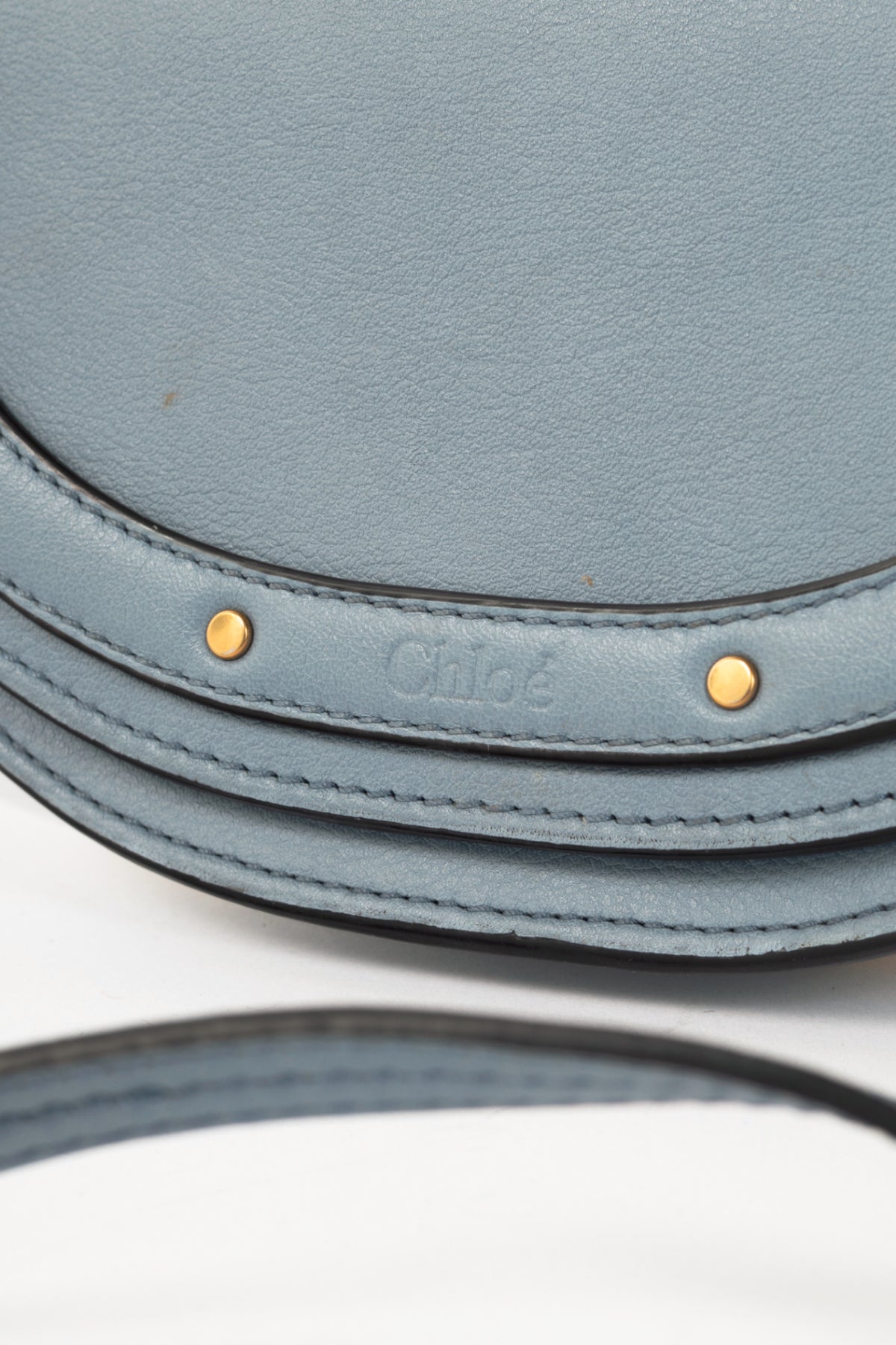 Chloe blue circle handle nile clutch
