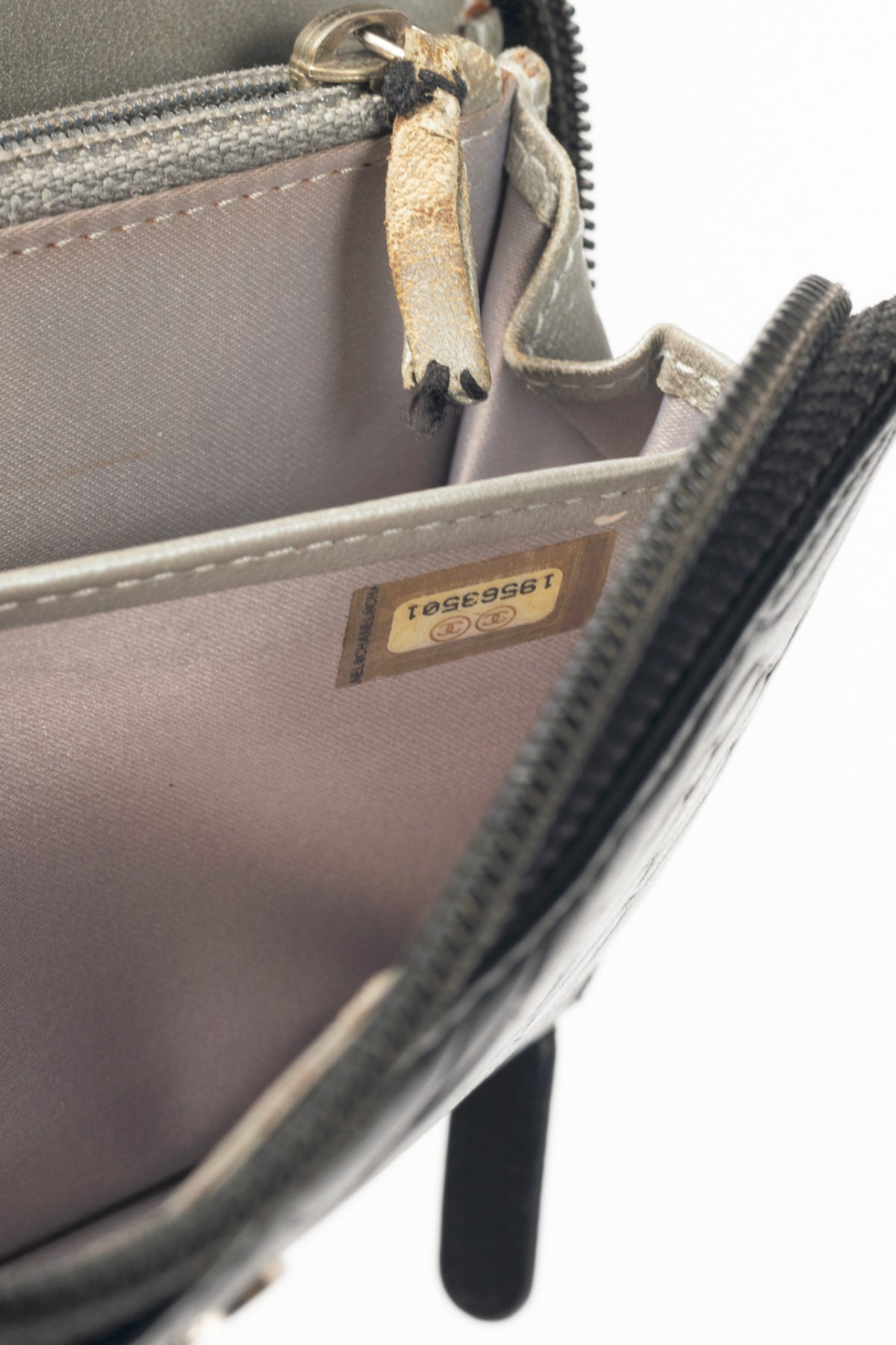 Chanel Black Camellia-Embossed Lambskin Zip Wallet