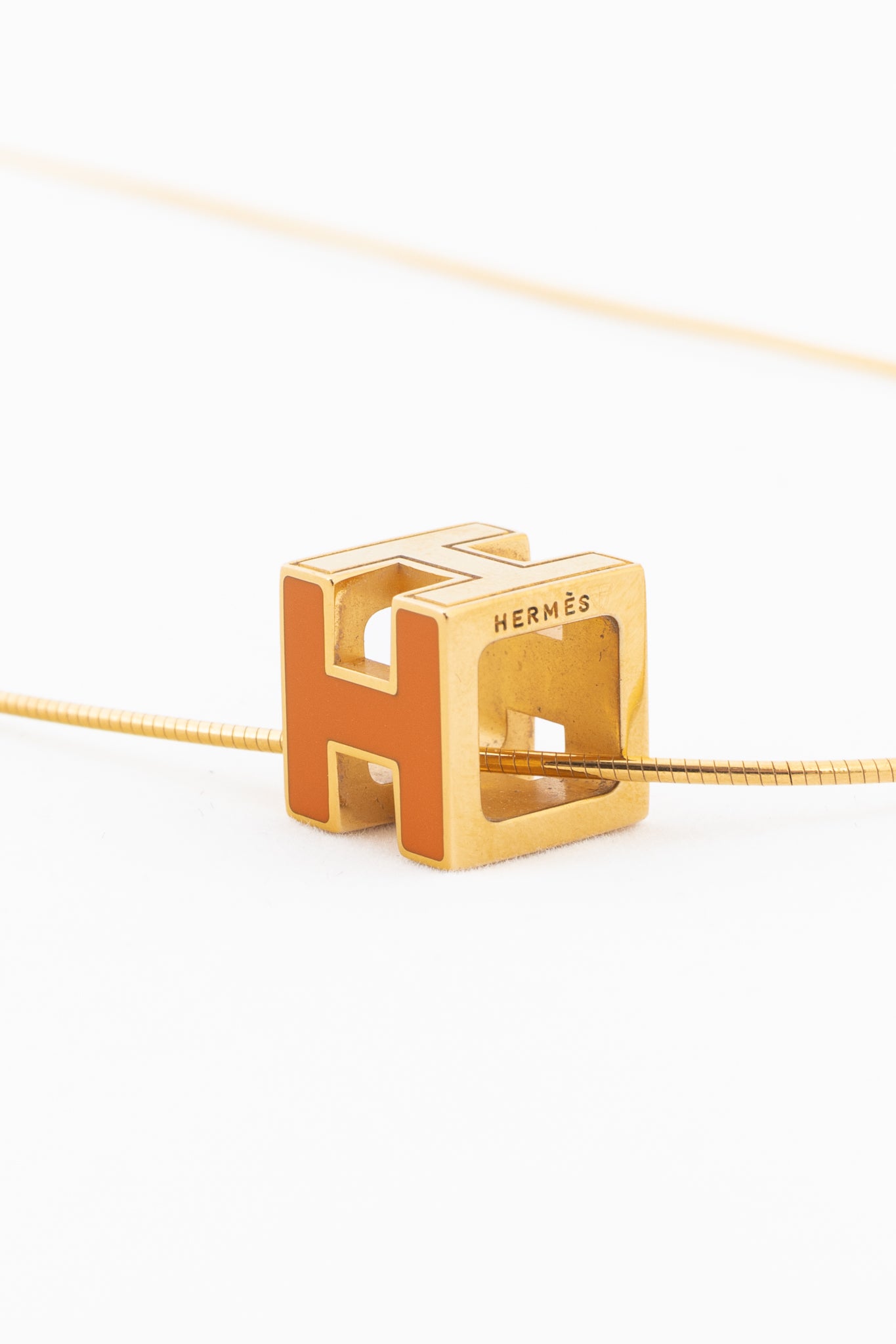 Hermes Cage D'H Gold Cube-Pendant Necklace – Blogger Armoire Hermes Cage D'H Gold Cube-Pendant Necklace – Blogger Armoire
