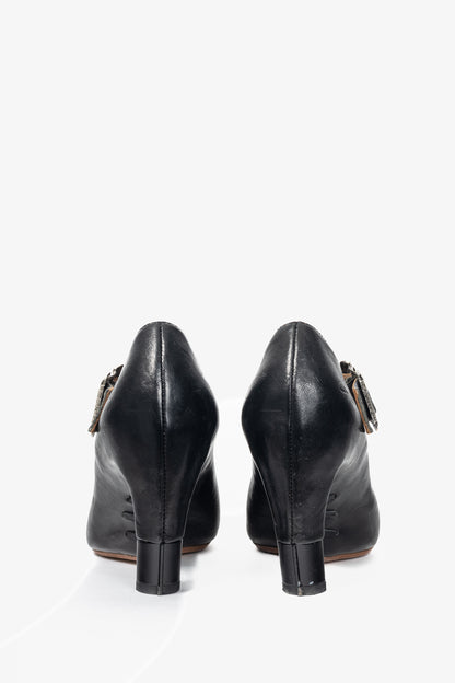 John Fluevog Pollux Black T-Strap Buckle Heels