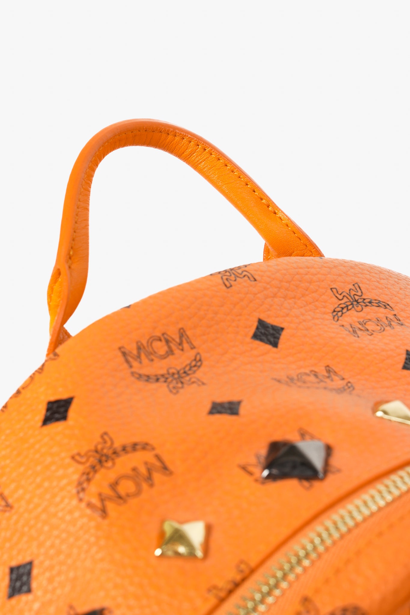 MCM Stark Metal Studs Orange Monogram Backpack