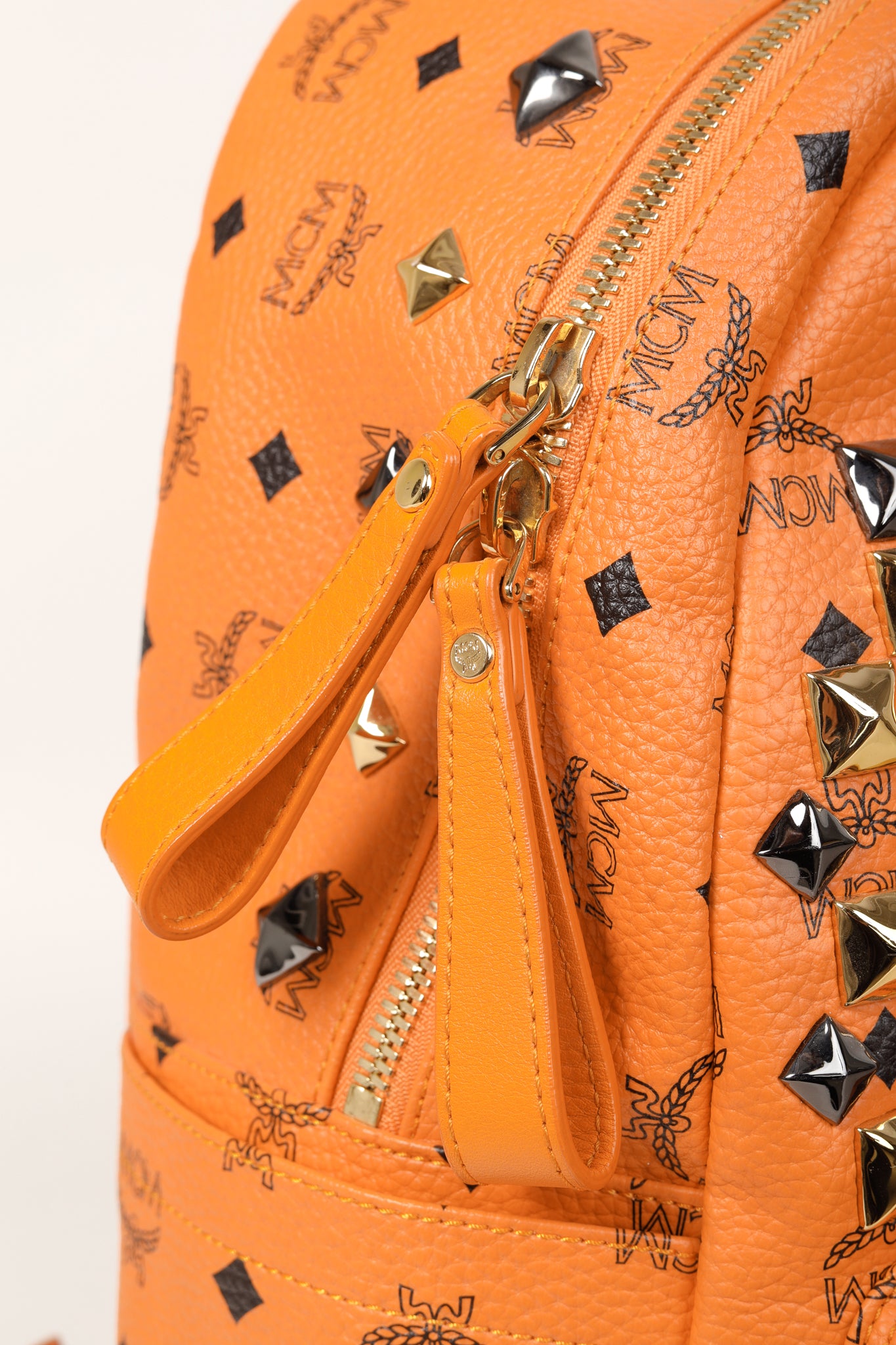 MCM Stark Metal Studs Orange Monogram Backpack