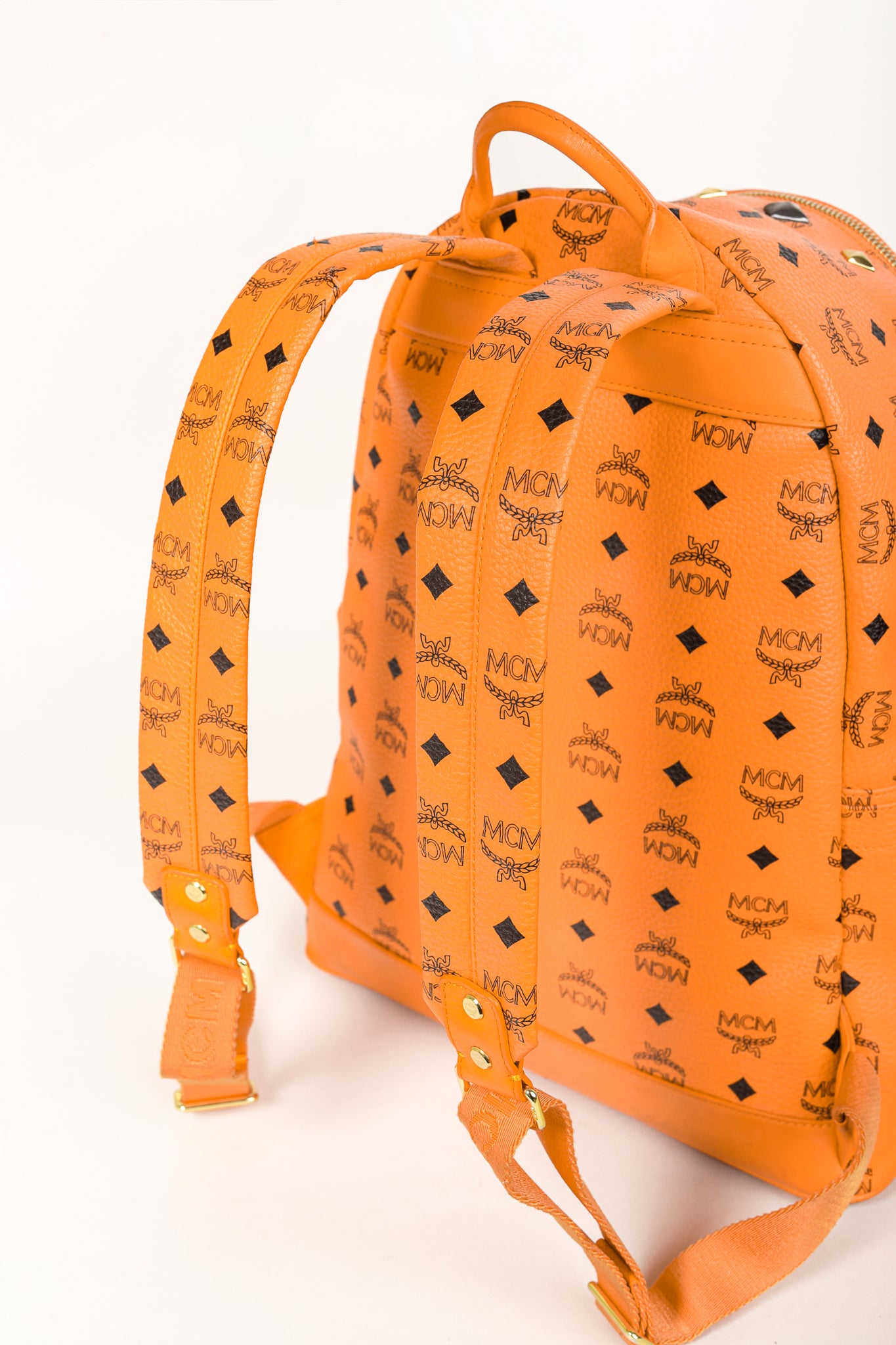 MCM Stark Metal Studs Orange Monogram Backpack