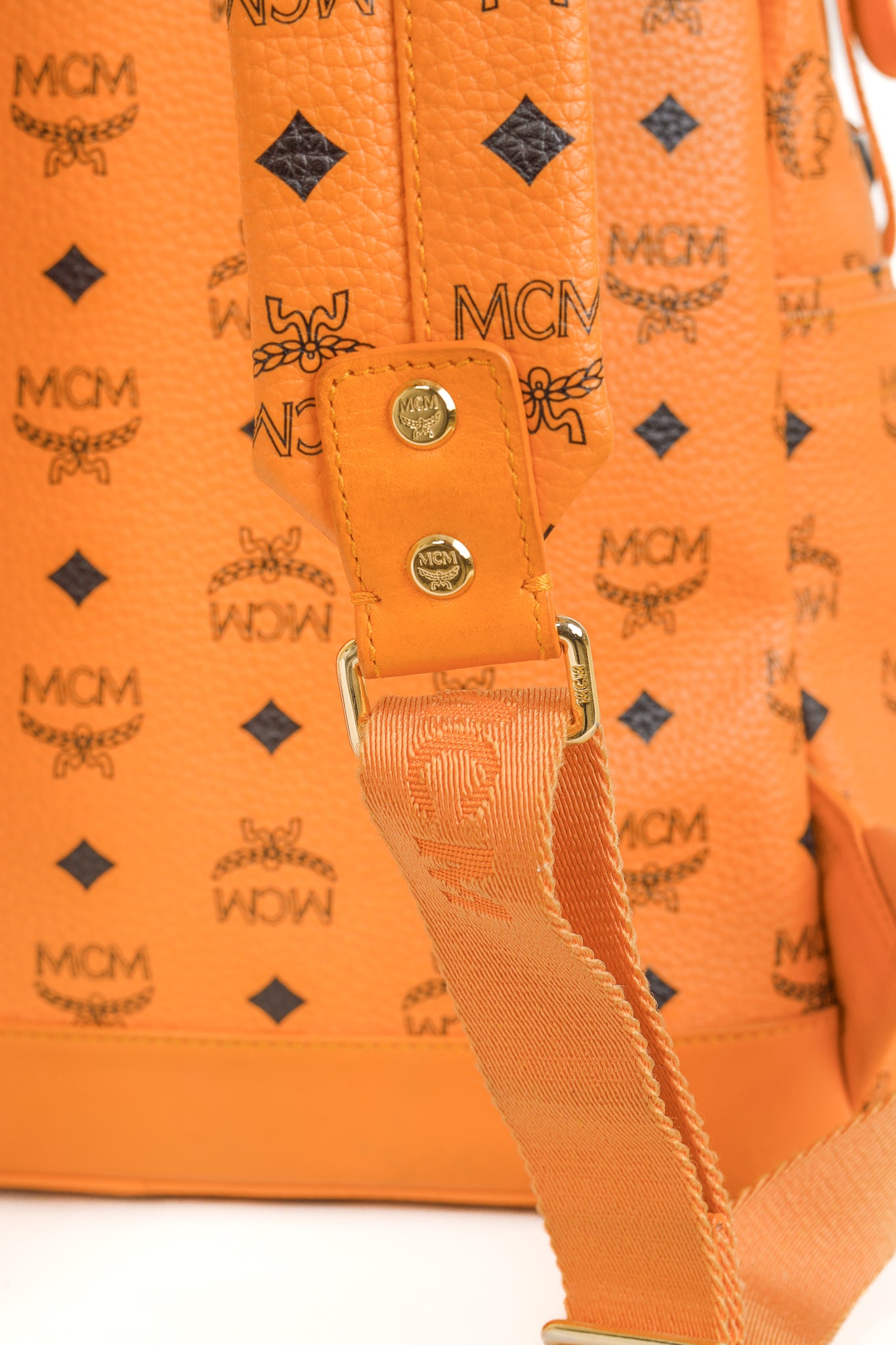 MCM Stark Metal Studs Orange Monogram Backpack